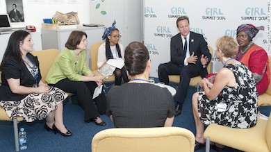British PM David Cameron meets activists at 'Girl Summit 2014' at Walworth Academy on July 22, 2014 in London, England.